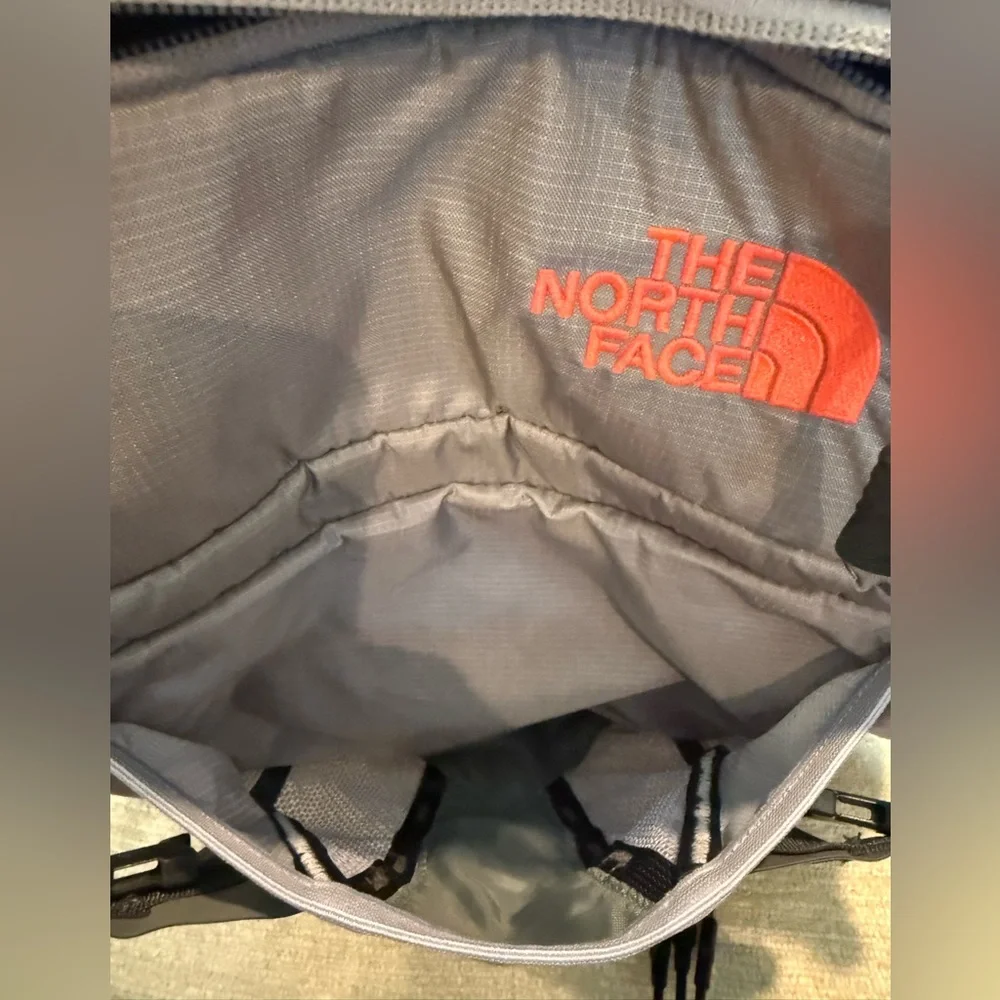 The North Face Gray and Black Backpack with Orange Logo